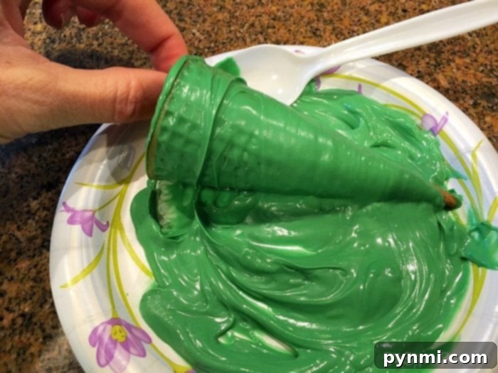 Process shot of melting chocolate for coating sugar cones in Christmas tree cupcake recipe.
