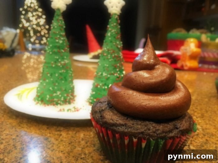A sugar cone Christmas tree topper with a sugar snowflake on top, showcasing the final decorative touch.