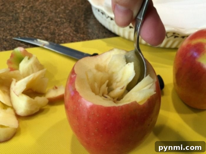 A mix of oats, brown sugar, and melted butter, forming the sweet filling for baked apple dessert.