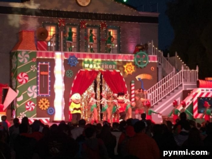 Knott's Berry Farm illuminated at dusk, showcasing holiday decorations and the iconic 'Knotts' sign