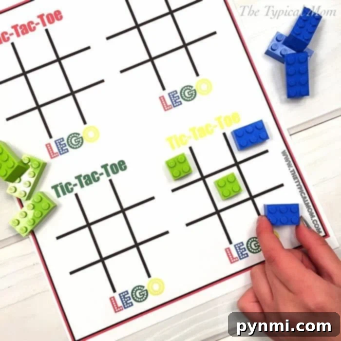 Kids playing Tic Tac Toe with LEGO bricks on a printable board, perfect for a LEGO themed birthday party or a fun activity.