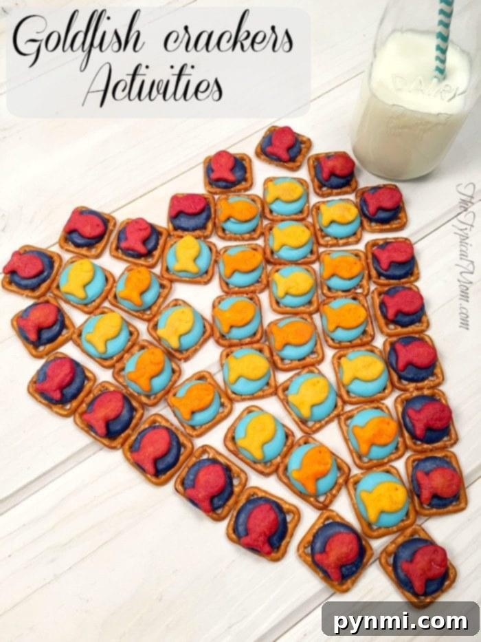 Goldfish crackers games like this fish tic tac toe game using different colors of Goldfish is fun to play! Great treats you can make with your kids as well as a game you can play with cheesy Goldfish crackers they all love! #freeprintable #printable #goldfish #games #tictactoe #game #fish Goldfish crackers games: a heart-shaped design made with colorful Goldfish and pretzels