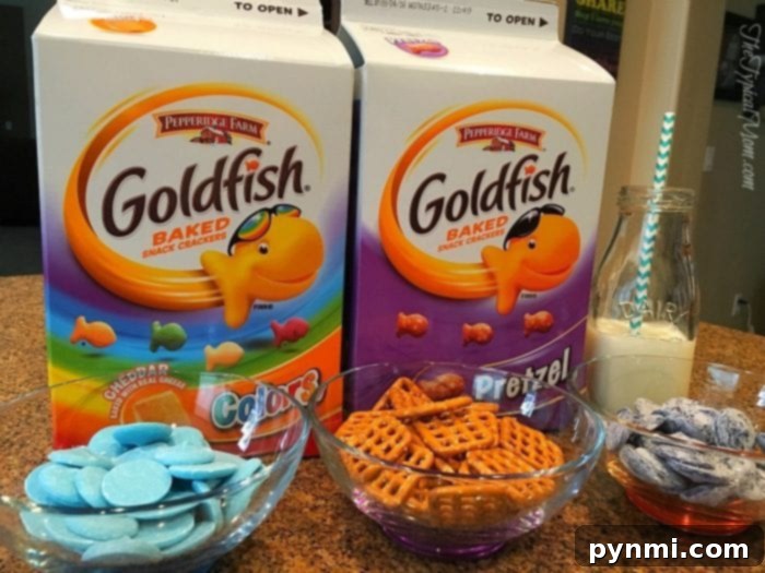 Free Print and Play Tic Tac Toe 4 Goldfish crackers snacks arranged with candy melts and pretzels for a sweet and salty treat