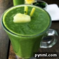 Close-up of a delightful superfood smoothie recipe in a glass, with a straw.