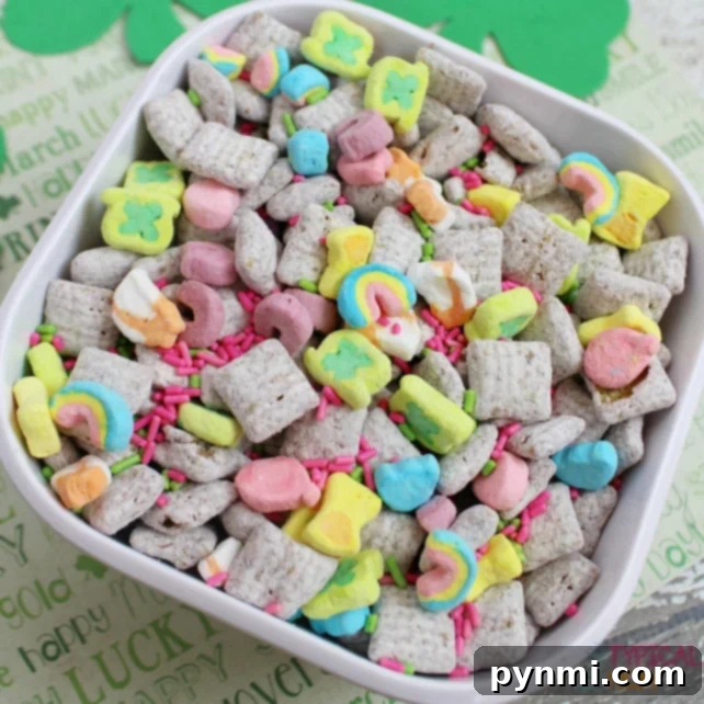 Muddy buddies recipe that is great for a party or gift idea. Add mix ins for every holiday to add some color to this crunchy peanut butter dessert. If you've never made this addicting snack some call puppy chow you are in for a real treat, just beware because you'll want to finish the whole bowl! A close-up of Peanut Butter Muddy Buddies recipe (Puppy Chow) with a generous coating of powdered sugar, showing its irresistible texture and ready-to-eat appeal.