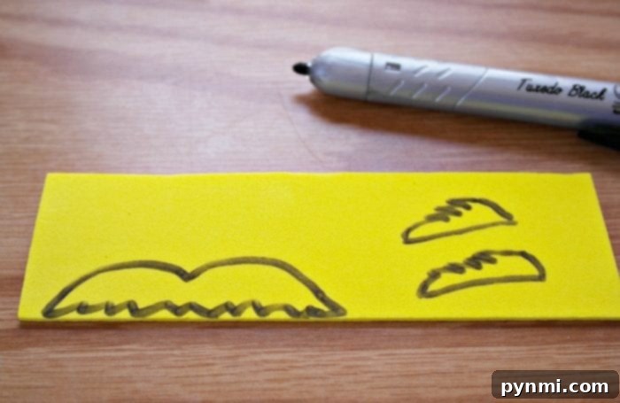 Whimsical Truffula Tree Finger Puppets 7 Template for the Lorax's mustache and eyebrows, cut from yellow craft foam.