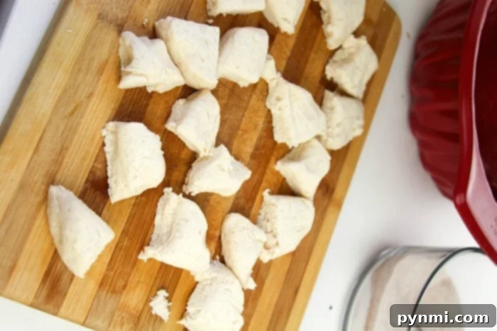 Effortless Monkey Bread Bake 4 Freshly baked monkey bread with biscuits, still in the pan.