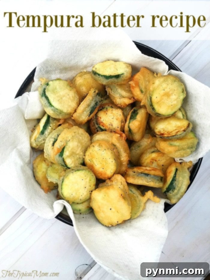 Tempura batter recipe that just needs 3 ingredients! You can make shrimp tempura, fried green beans and tempura vegetables at home. It's a great way to make a crunchy side dish the kids will definitely love. #tempura #batter #easy #recipe #fried #zucchini #vegetables #shrimp Plate of golden tempura zucchini, ready to be served as a delicious side.