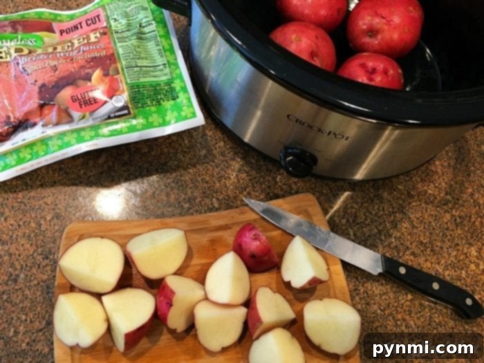 This slow cooker corned beef brisket recipe that's amazing! If you want to know how to cook corned beef brisket and cabbage in the crockpot it's super easy to do and should definitely be made more often than just on St. Patrick's Day. Corned beef in the crockpot with beer being poured over it