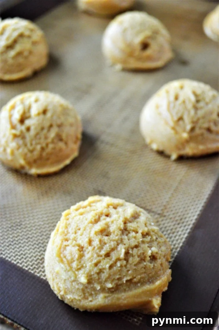 Freshly baked peanut butter cake mix cookies cooling on a wire rack, ready to be enjoyed.