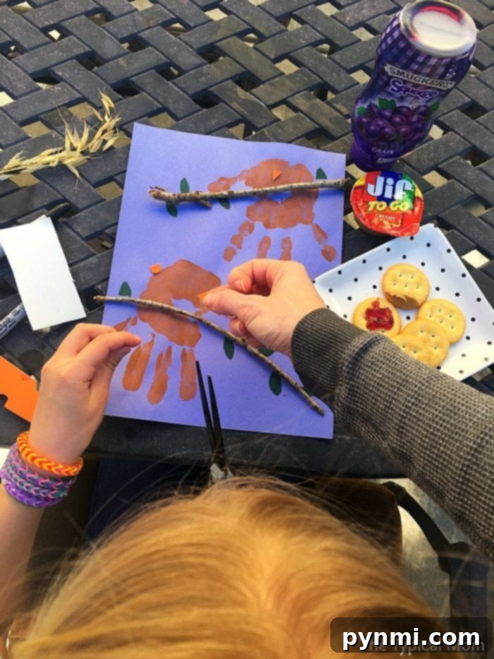 Budget-Friendly Kids' Fun 4 Kids enjoying a creative craft activity with handprint art and natural elements