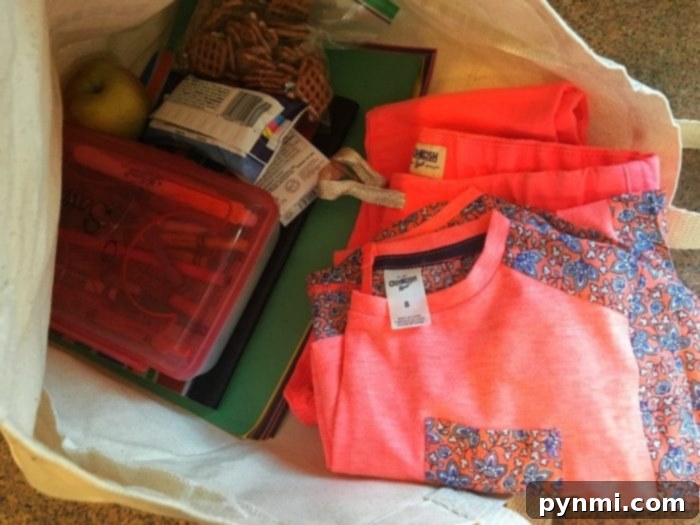 The Great Indoors Spring Getaway 4 Kids packing their bags for a fun Spring Break staycation adventure, featuring comfortable OshKosh B'Gosh clothing.