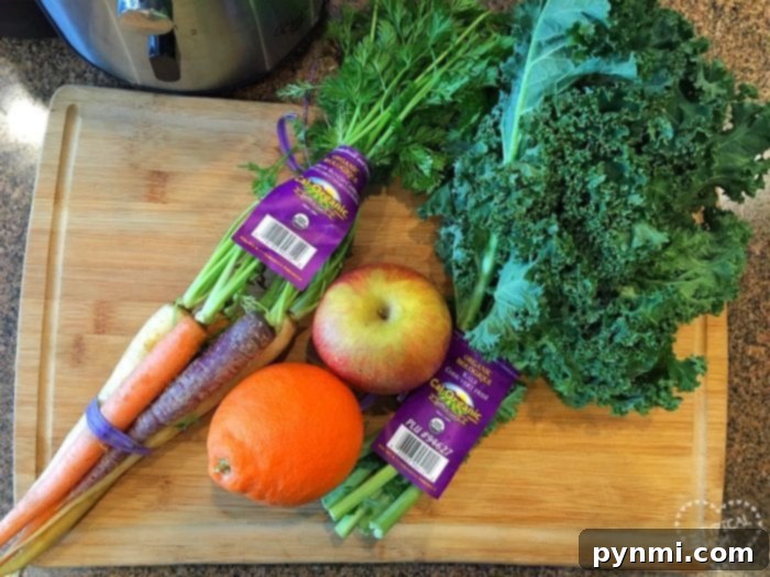 Unlock the Power of Kale: Juicing Made Easy 5 Carrots, an apple, an orange, kale, and celery sit on a wooden cutting board next to a slow cooker; these are perfect for crafting easy kale recipes.