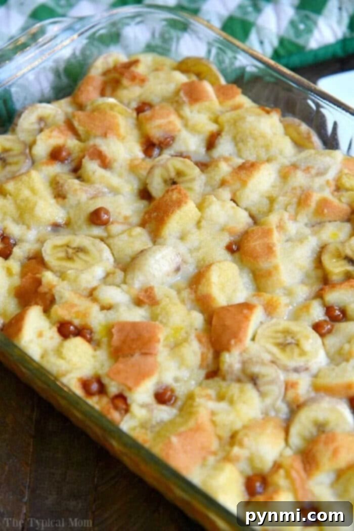 Decadent Banana Bread Pudding 5 Homemade banana bread pudding cooling in a baking dish, perfectly golden brown.