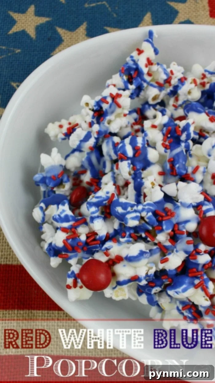 Red white and blue popcorn recipe is a perfect Memorial Day side dish or 4th of July dessert too. Chocolate popcorn with patriotic colors. fourth of July dessert