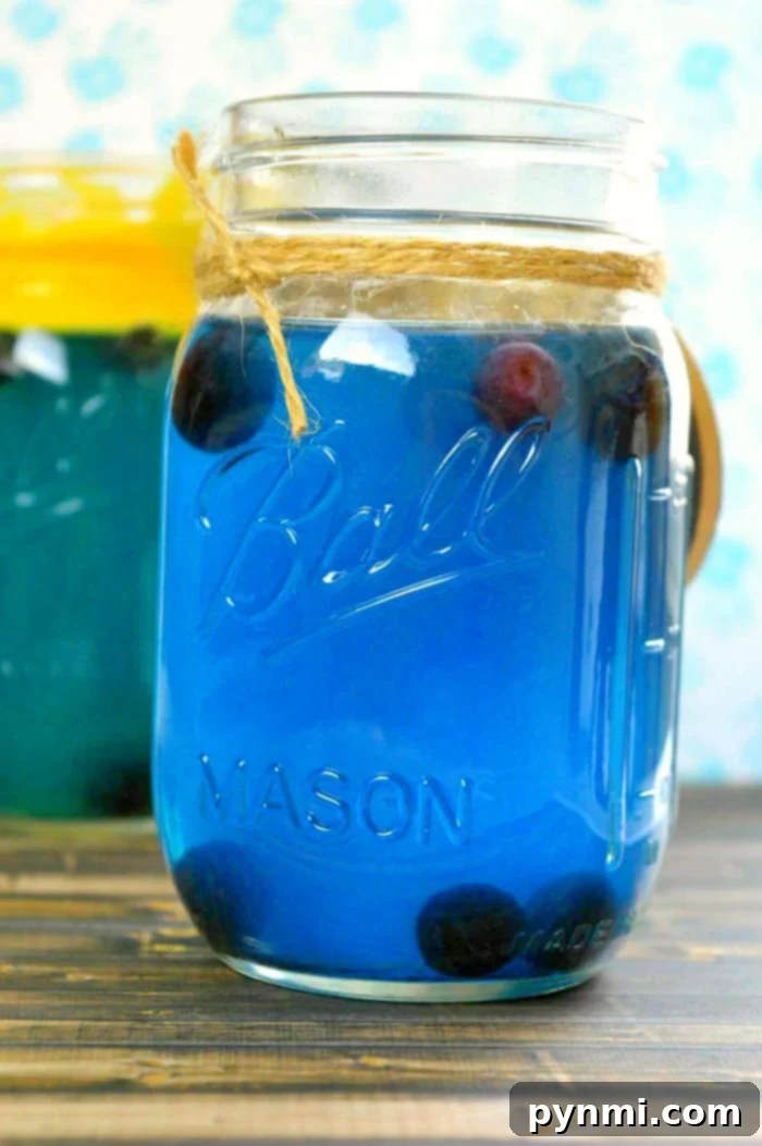 Blue punch for a baby shower. #drinks #babyshower Refreshing blue drinks for a baby shower, served in a charming dispenser.