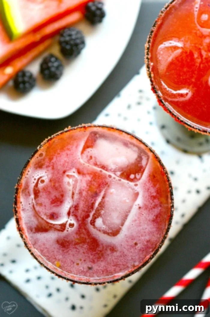 Watermelon drink. #drink #watermelon A refreshing watermelon drink garnished with mint and lime slices, perfect for a baby shower.