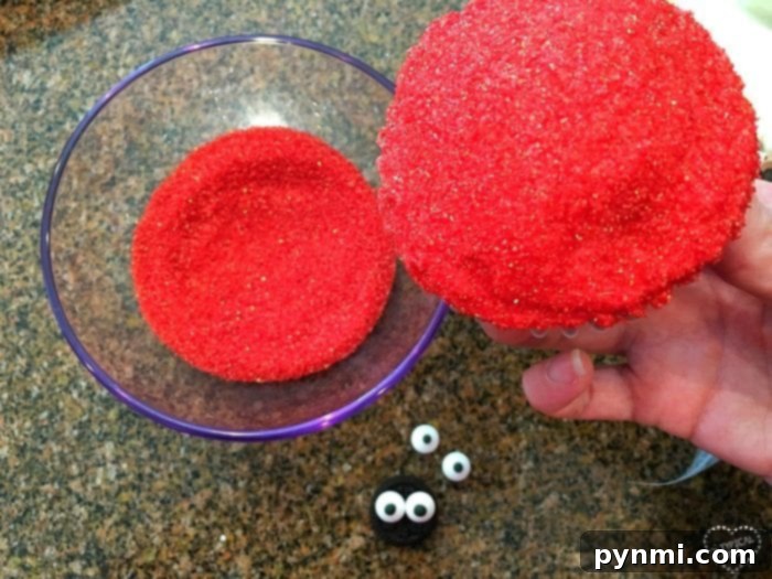 Whip Up Charming Ladybug Cupcakes 2 A small bowl filled with red sanding sugar, ready for dipping frosted cupcakes to create the ladybug's body.