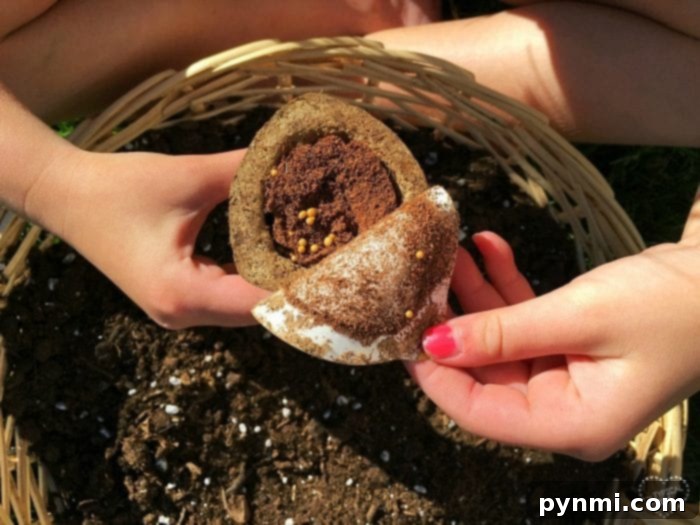 Little girl carefully watering her newly planted seed starter pots in a repurposed container
