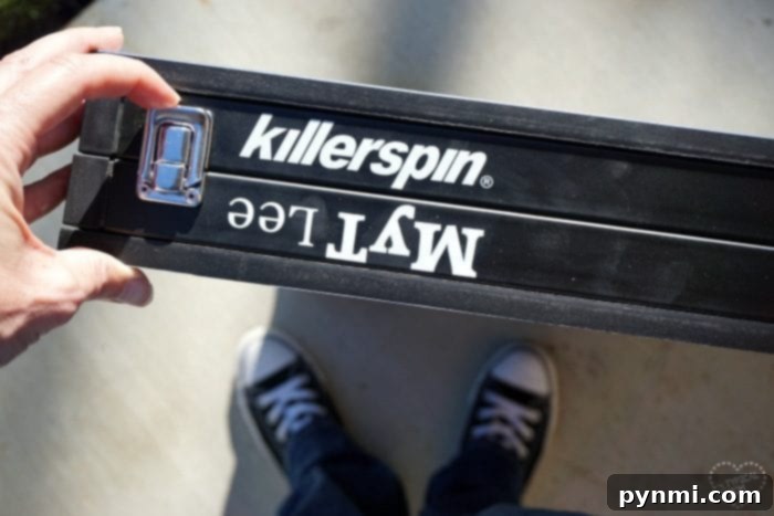 Review blogger demonstrating Killerspin mini table features