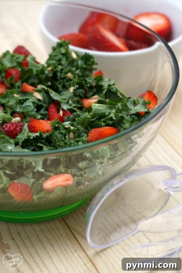 Vibrant Kale Strawberry Salad: A healthy and easy side dish for barbecues or dinner. Fresh Kale Strawberry Salad with a drizzle of balsamic dressing, perfect for any meal