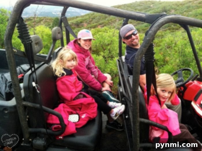 A family enjoying a road trip in an off-road vehicle, demonstrating free travel options