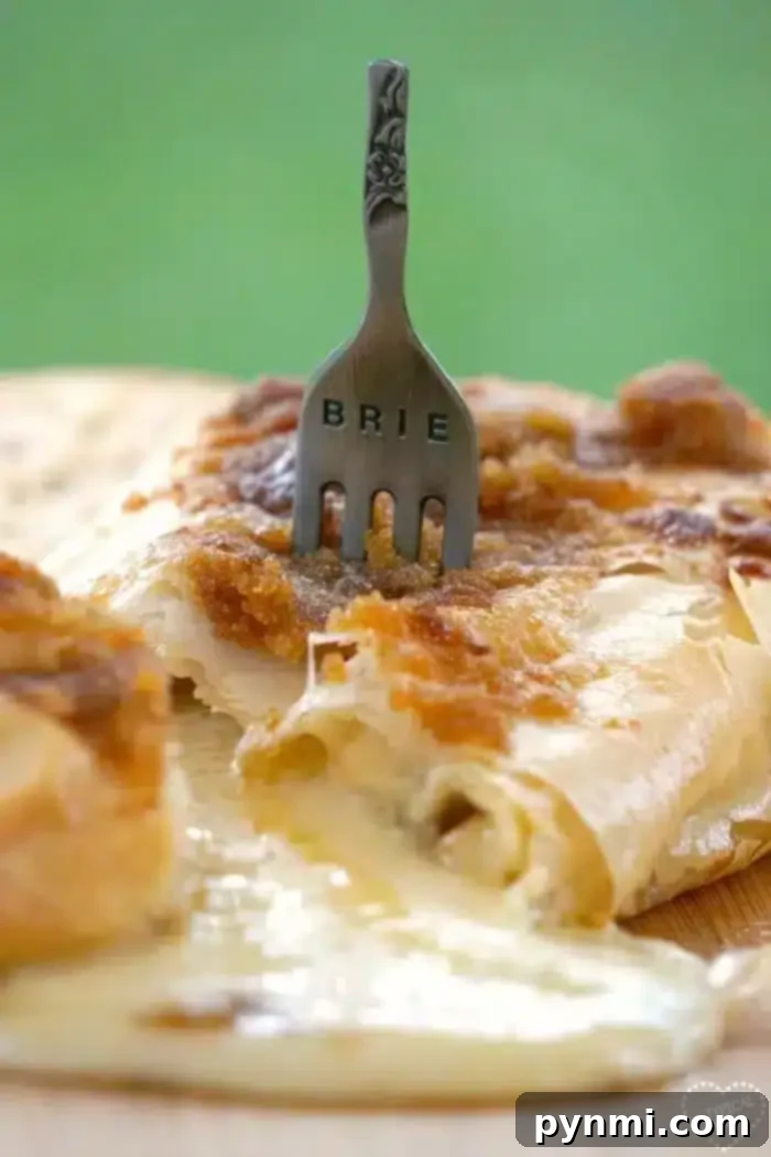 Delicious baked brie with phyllo dough, perfect for an appetizer.