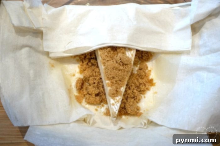 Easy baked brie recipe with golden phyllo crust.