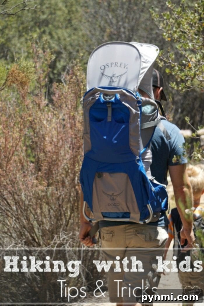 Essential Tips for Hiking with Kids Happy family hiking with kids in nature