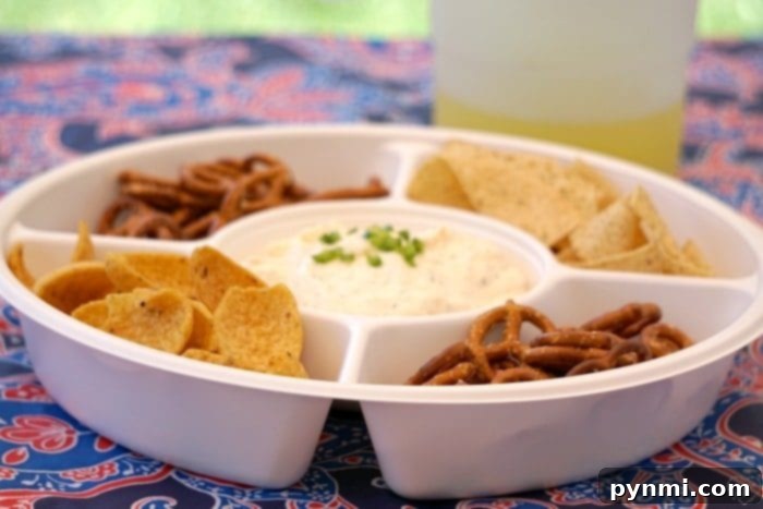 Golden Brew Cheese 6 A freshly prepared beer cheese dip in a simple white bowl, ready for serving.