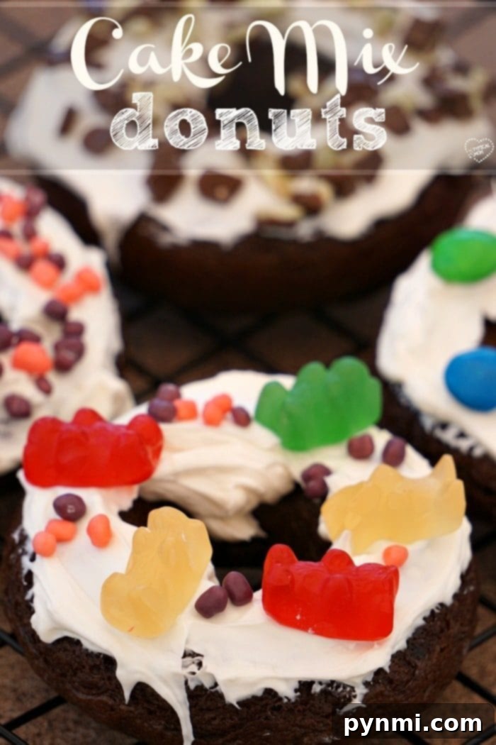 A plate of freshly baked cake mix donuts, some plain and some decorated.