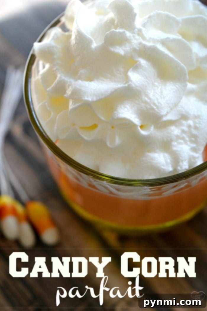 Colorful candy corn parfait: an easy layered dessert Layers of candy corn parfait in a glass jar, a colorful Halloween treat