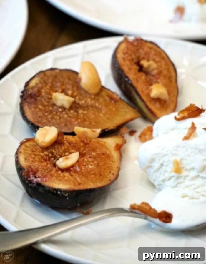 A plate of freshly baked figs with ice cream and nuts, showcasing the finished dessert