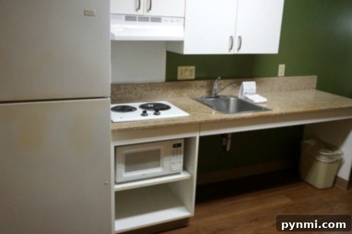 Close-up of a clean Extended Stay America stovetop and microwave