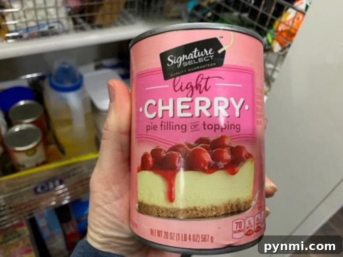 Close-up of cherry pie filling, a key ingredient for crockpot lava cake.