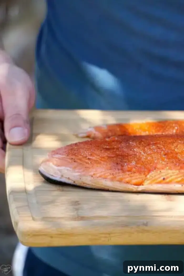 A perfectly smoked salmon fillet, golden brown and flaky, ready to be served.