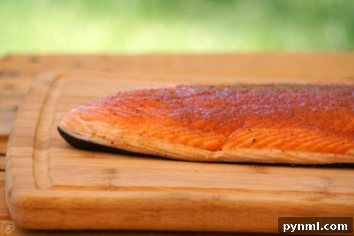 Platter of smoked salmon with garnishes, ready to be enjoyed.