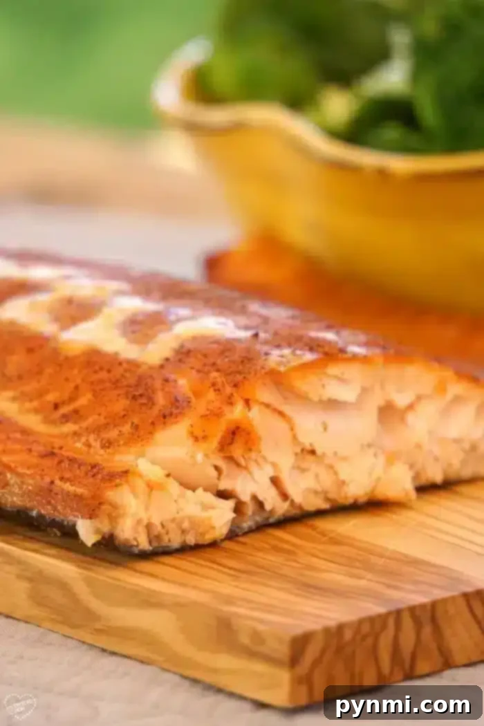 Smoked salmon presented beautifully on a cutting board, ready for slicing.