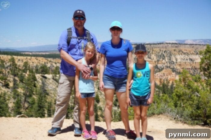 Smiling family portrait with Bryce Canyon's incredible backdrop