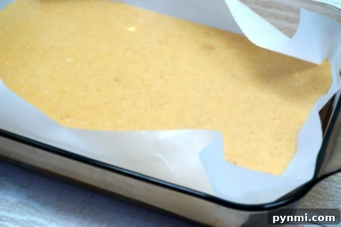 Pumpkin fudge, no bake! Stack of smooth pumpkin fudge pieces, garnished with a sprinkle of cinnamon.