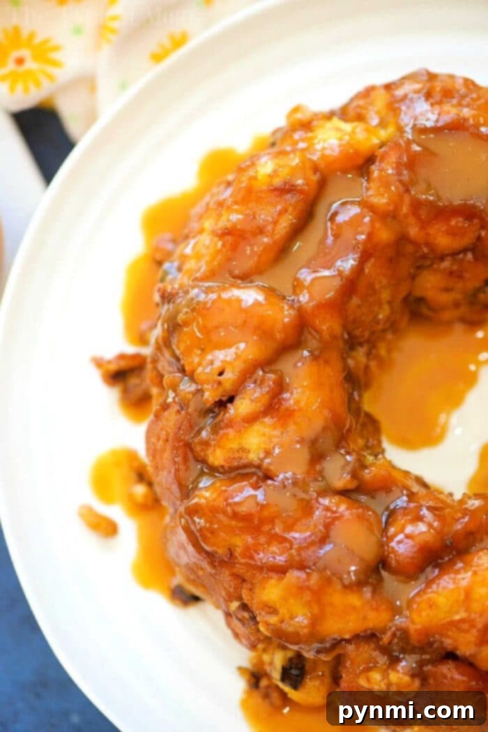 Gooey Pumpkin Spice Monkey Bread 2 Delicious Caramel Pumpkin Monkey Bread Ring with a glistening glaze, perfect for Fall.