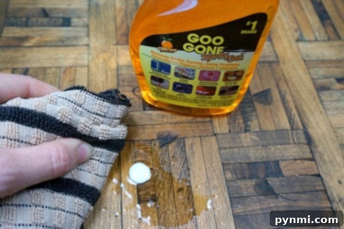 Goo GONE® product bottle, highlighted as an essential for easy cleanup of craft messes, showcasing its effectiveness.