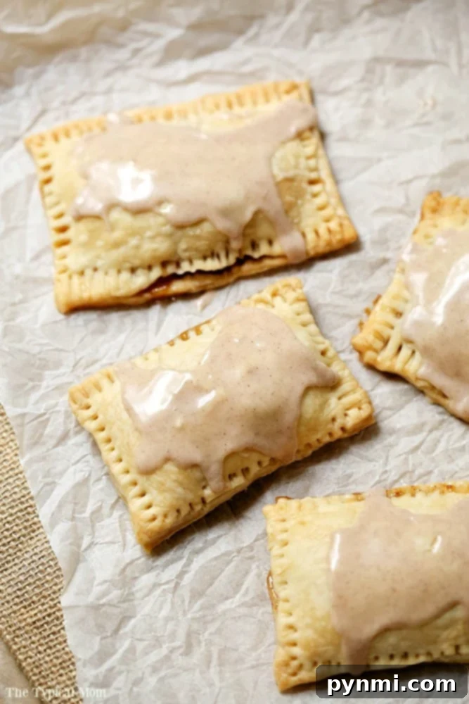 Close-up of a homemade pop tart with a delicious apple filling spilling out slightly
