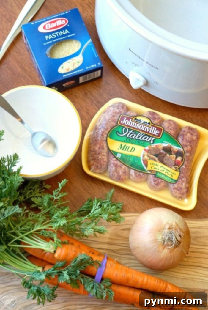 A vibrant bowl of homemade Italian Wedding Soup, brimming with small meatballs, fresh carrots, and leafy greens, ready to be served.