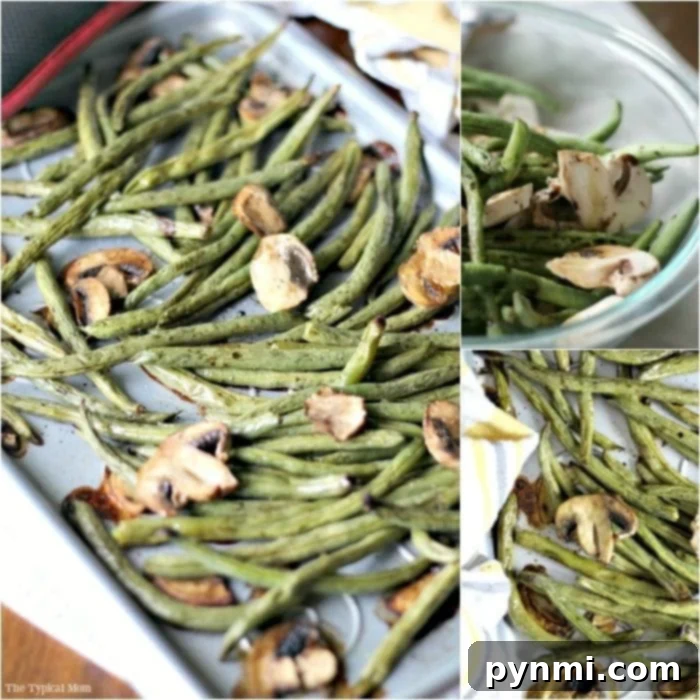 Golden brown baked green beans with garlic and herbs on a sheet pan, ready to serve.