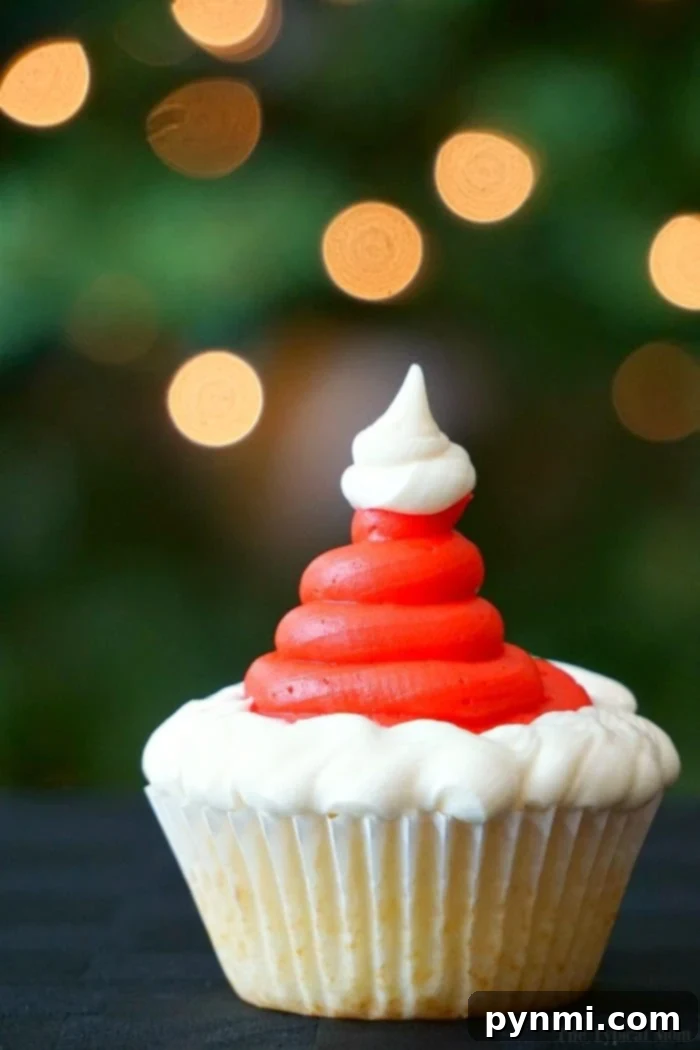 Santa cupcakes are fun and easy to make at Christmas! Find these and how to make Christmas tree cupcakes too here. Fun holiday activities for kids solved. #santa #santaclaus #christmas #cupcakes #dessert Santa hat cupcakes, a fun and easy Christmas dessert for kids and families.