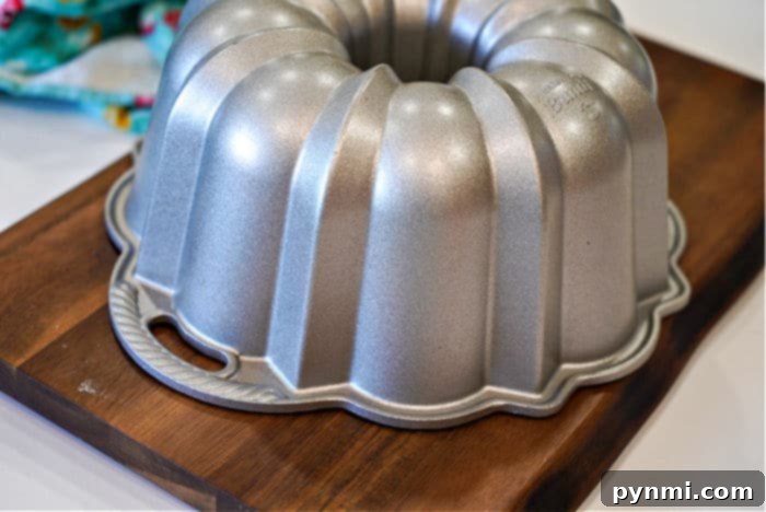 Bundt pan on a kitchen counter, ready for baking savory or sweet dishes.
