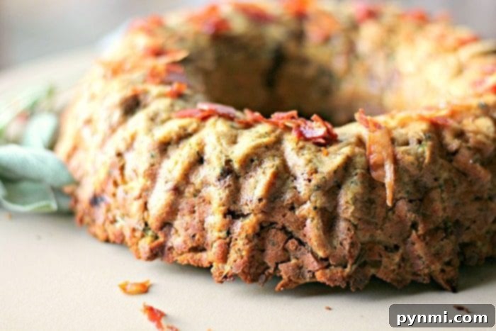 Close-up of golden-brown stuffing in a bundt pan, ready for unmolding.