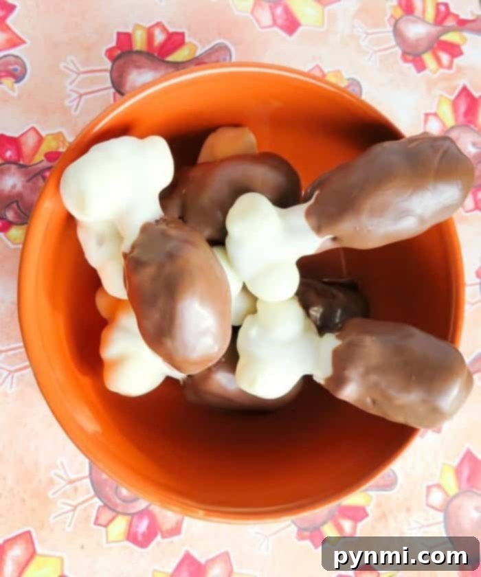 Snickers turkey drumsticks are so fun to make at Thanksgiving! Perfect edible Thanksgiving craft for kids or just make to serve as dessert. #thanksgiving #dessert #treat #drumsticks #legs #turkey #snickers #candy Snickers Turkey Leg Treats