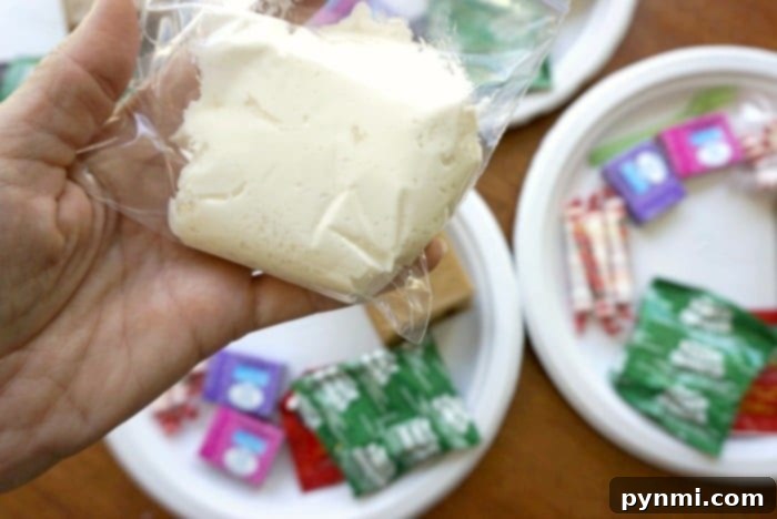 Build Your Own Gingerbread Masterpiece 4 Preparing frosting for gingerbread houses, showing frosting in a small plastic bag ready for piping.